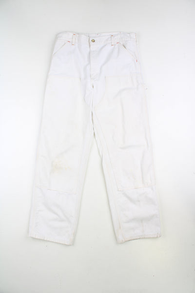 Carhartt double knee carpenter jeans in white, with multiple pockets with logo on the back pocket