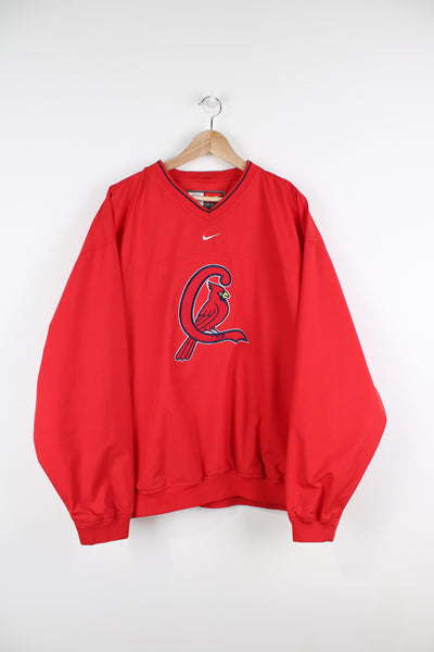 Vintage St Louis all red training top/pullover by Nike. Features large embroidered Cardinal's logo on the front and pockets