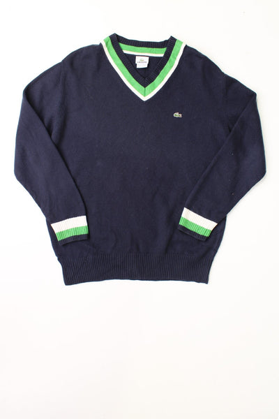 Lacoste navy blue V-neck knit jumper with green and white stripe detailing along the neck and cuffs, and an embroidered logo in green on the left. 