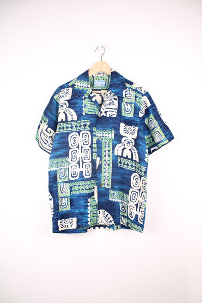 Vintage Hawaiian Shirt in a blue, green and white patterned colourway, button up with a camp collar and has a chest pocket. 