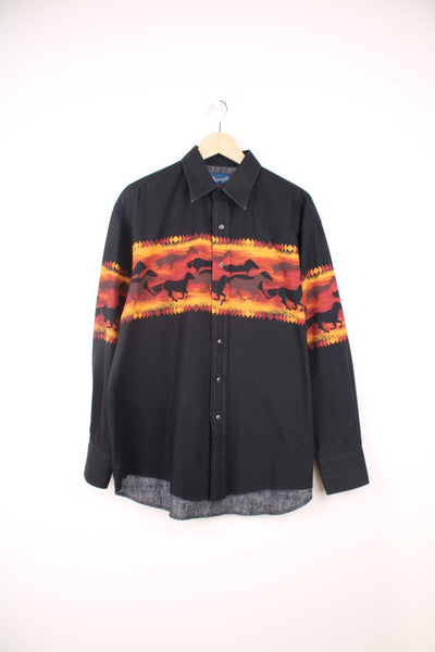 Vintage Wrangler Western Shirt in a black and orange colourway, button up with a dagger collar, and has horses running graphic print going across the shirt.