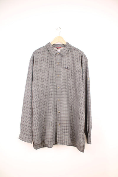 The North Face Shirt in a grey and white plaid colourway, button up, and has a chest pocket with the logo embroidered on. 