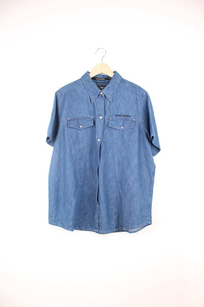 Harley Davidson Denim Shirt in a blue colourway, short sleeve button up shirt, has double chest pockets and the logo embroidered on the front and back.