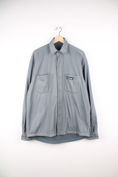 Vintage Paramo reversible velour shirt. Features embroidered logo.