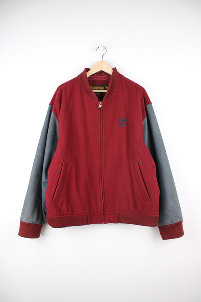 Vintage Timberland bomber jacket in red and blue. Features embroidered logo on the chest and embroidered spell out logo across the back.