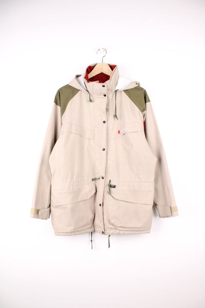 Vintage Berghaus Gore-Tex jacket in beige, red and khaki green. Features embroidered logo on the chest and a fold away hood.