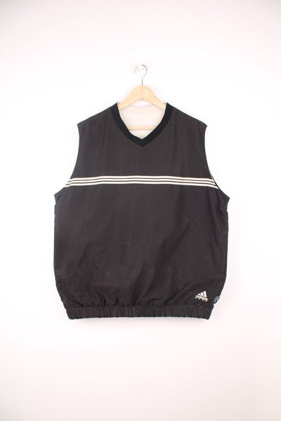 Vintage Adidas Climashell fleece/windbreaker vest in black and beige. Features signature three stripes across the chest and embroidered logo.