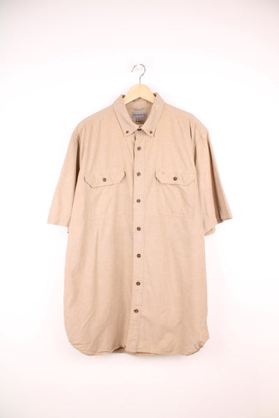 Carhartt Short Sleeve Shirt in a tanned colourway, button up, has double chest pockets and the logo embroidered on the front. 